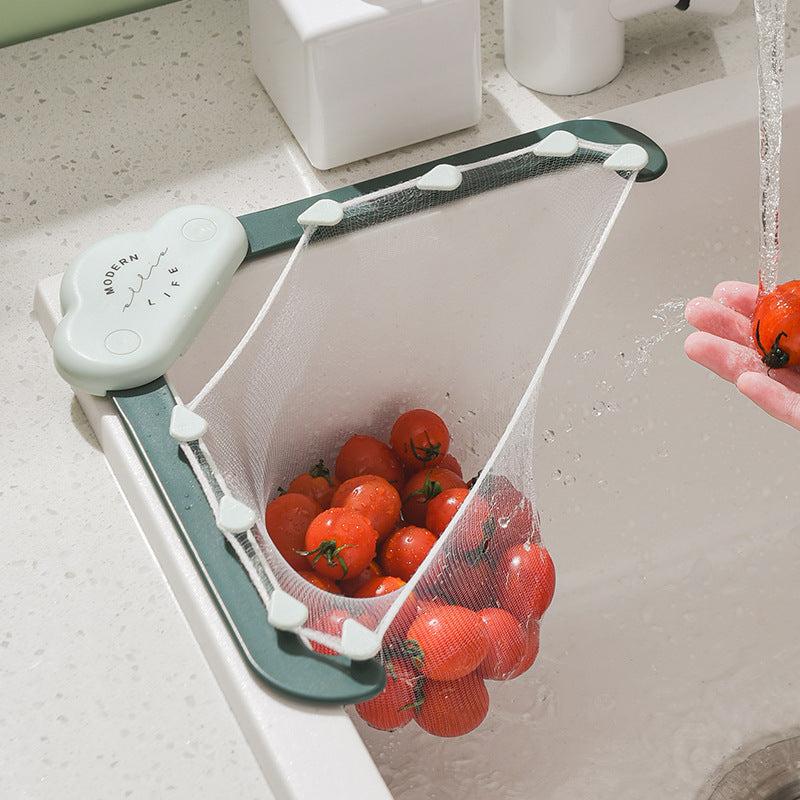 Corner sink strainer in a kitchen sink