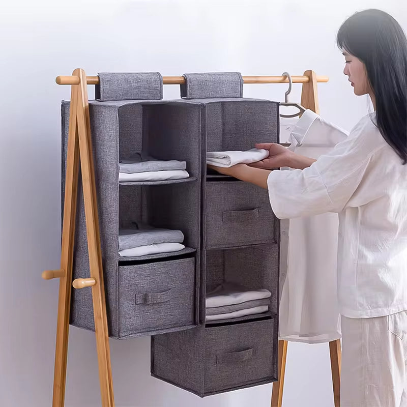 Hanging closet shelves with folded clothes