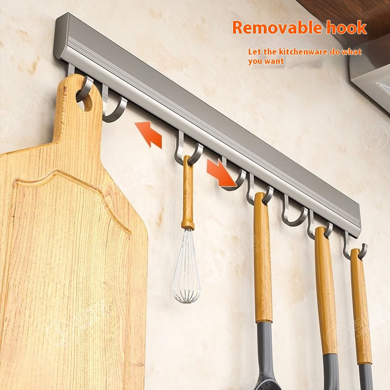 Aluminium hook rail on a kitchen wall